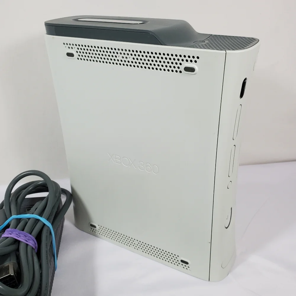 Xbox 360 with 4 games, 2 Controllers Tested Excellent.Condition is Excellent,